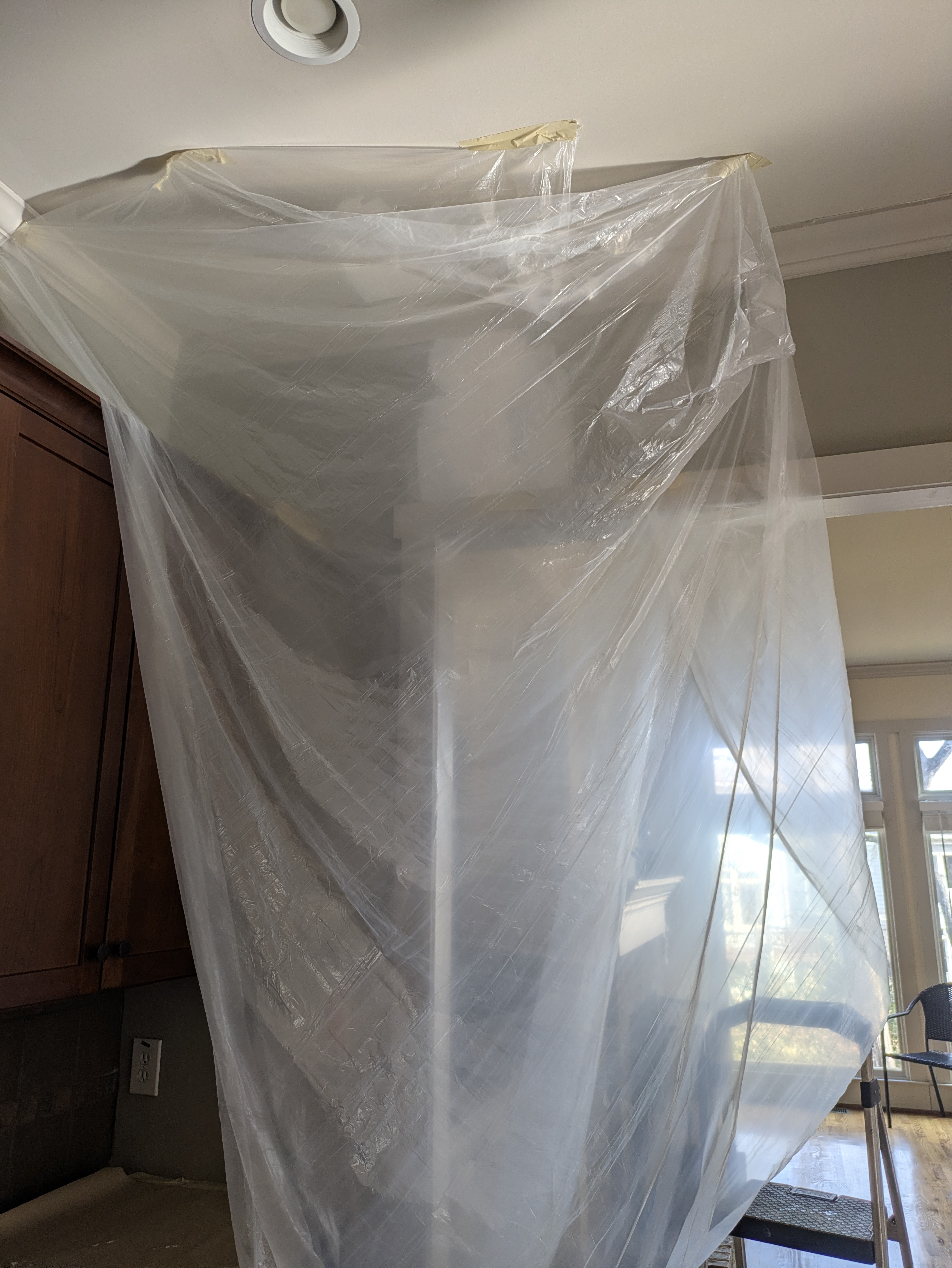 Zip-wall dust containment system installed in an Athens kitchen
